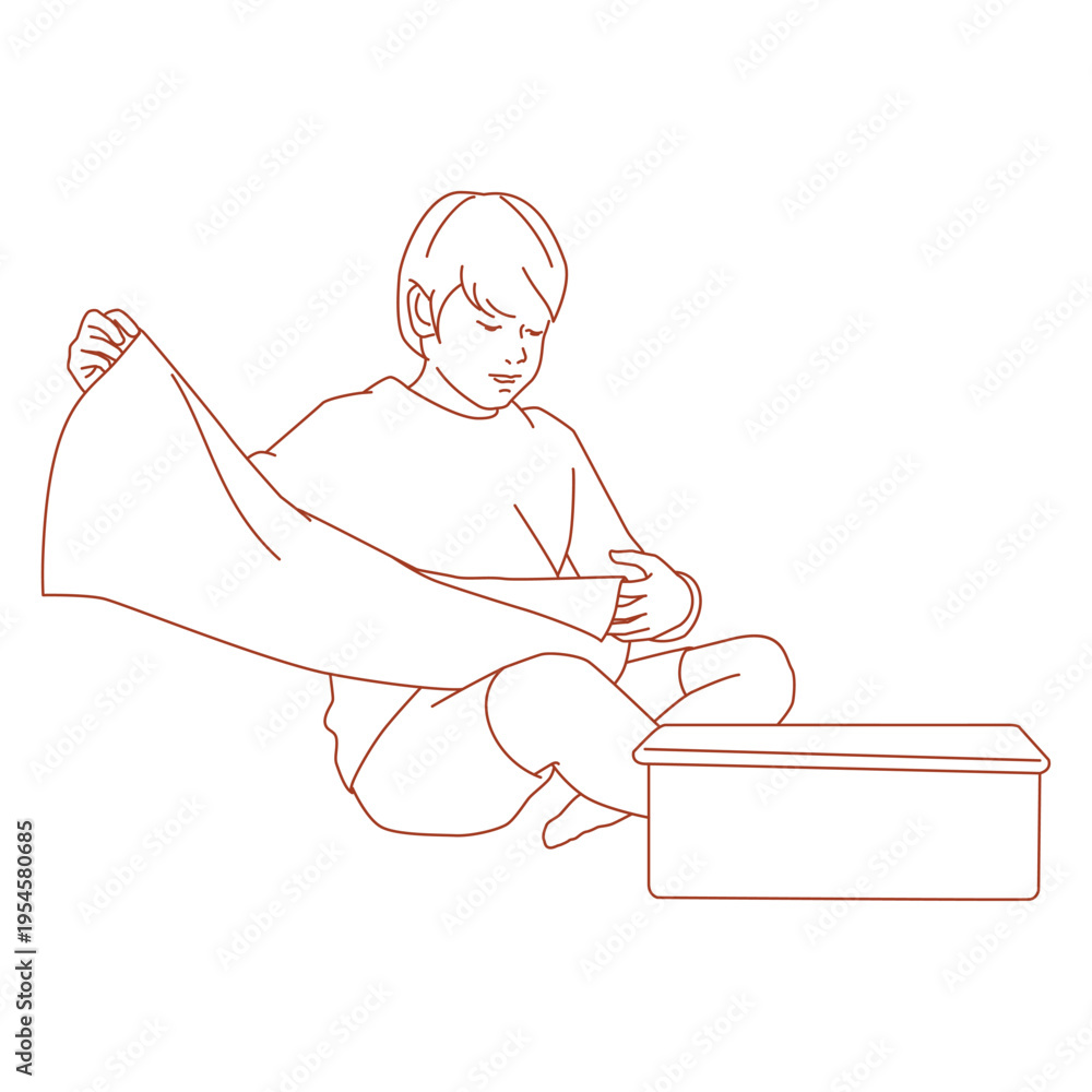 Obraz premium boy folding clothes while sitting on the floor.eps