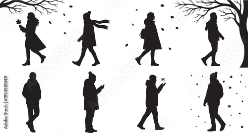 Silhouettes of people walking in winter scenery with snow