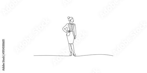Confident businesswoman standing with one hand on her hip in a professional outfit