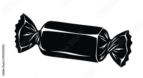 A black candy wrapper with twisted ends a striking silhouette