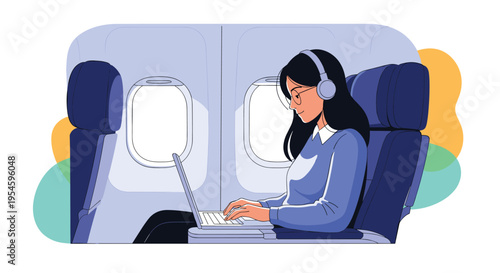 Focused young woman sits in an airplane seat wearing headphones and working on her laptop during a commercial flight.