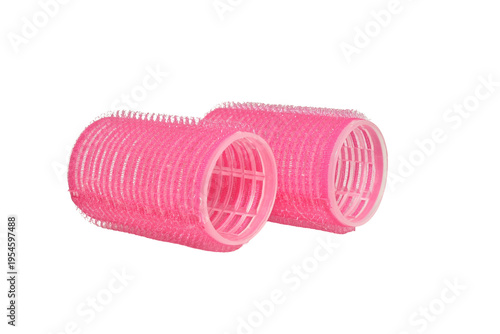 Foto Pink Velcro hair curlers isolated on white background.