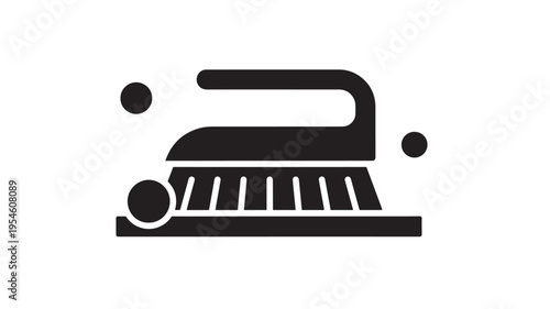 Brush icon with dots representing cleaning or scrubbing elements, a simple graphic symbol for household tasks.