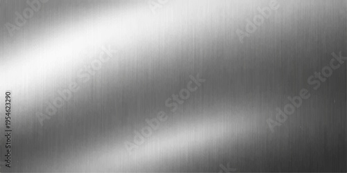 A polished stainless steel plate creates a shiny metallic backdrop with a brushed silver texture and gray industrial pattern on the reflective aluminum surface