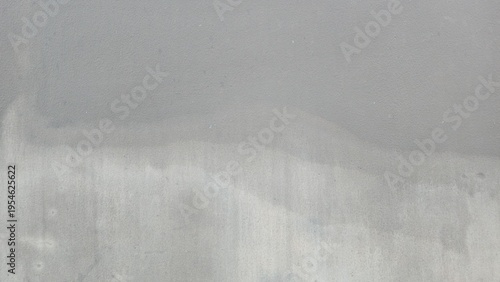 Fotografie Distressed grey cement surface with weathered water marks