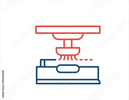 An industrial manufacturing machine performing a process on a workpiece with a robotic arm
