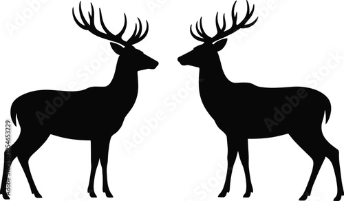 Two Deer Silhouettes Facing Each Other with Large Antlers, Black Wildlife Vector Illustration, Symmetrical Stag Design Isolated on Light Background for Nature, Hunting, Logo Use