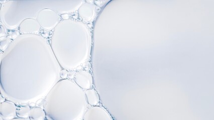 Clear liquid bubbles macro abstract water texture transparent fluid surface minimal clean background soft light close up science cosmetic serum texture.