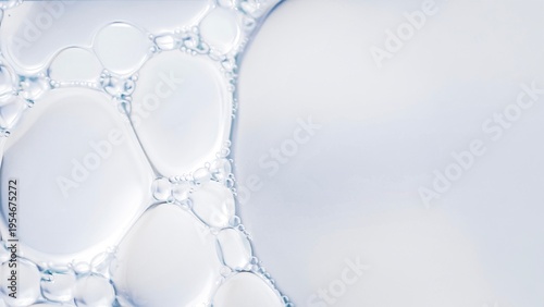 Clear liquid bubbles macro abstract water texture transparent fluid surface minimal clean background soft light close up science cosmetic serum texture.