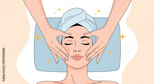 Relaxed young woman with eyes closed receives a gentle facial massage from a spa therapist with her hair wrapped in a soft blue towel.