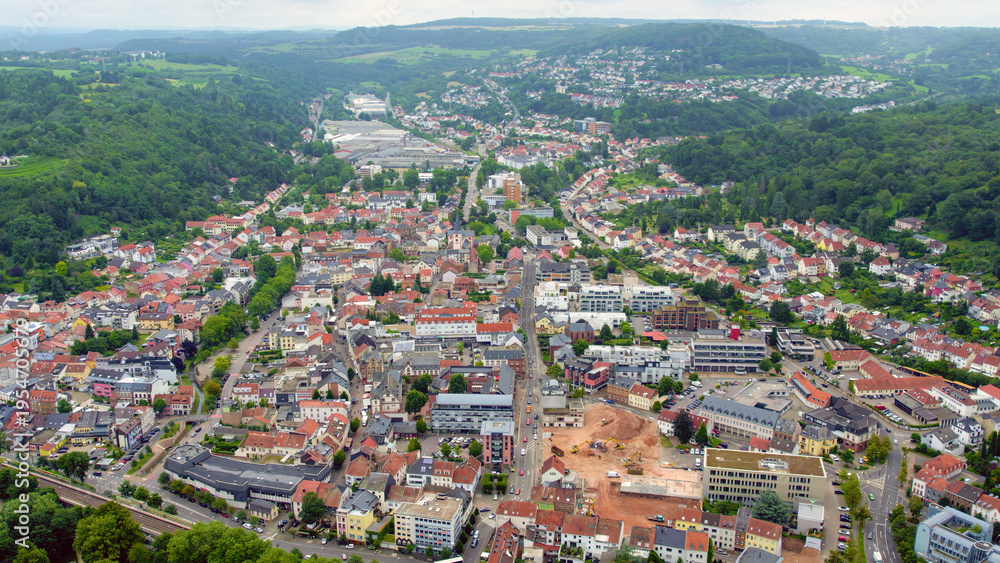 Obraz premium Aerial view around the city Merzig in Germany on a cloudy spring noon