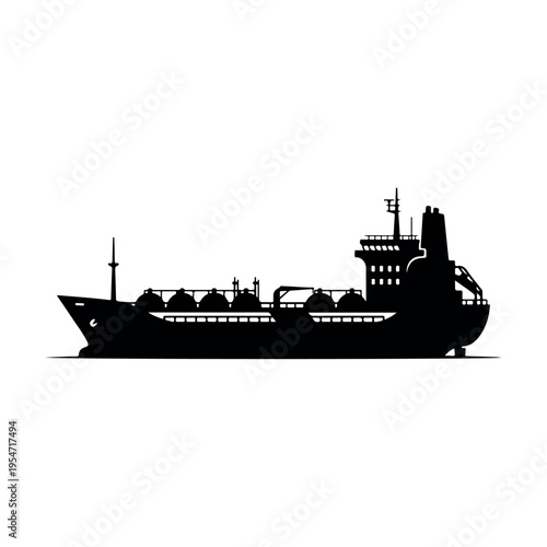 Silhouette of industrial cargo ship at sea during dusk with calm waters and minimalist composition