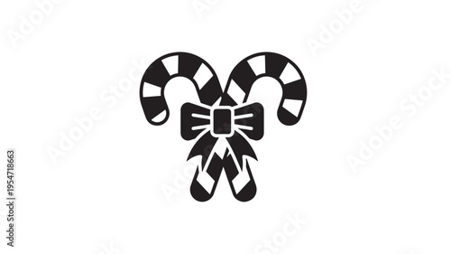 Candy canes crossed with black and white stripes and a bow tie graphic symbol for Christmas celebration