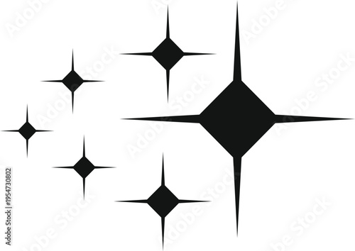 Group of black sparkle stars creating a glitter effect on white