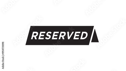 Reserved sign on a black surface with white text indicating an occupied table or space in a restaurant or event venue.