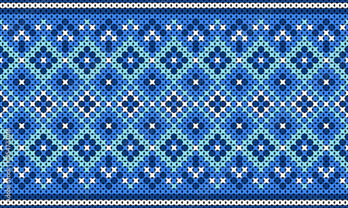 Cross-stitch knitting patterns in shades of blue and navy in an ethnic native style.