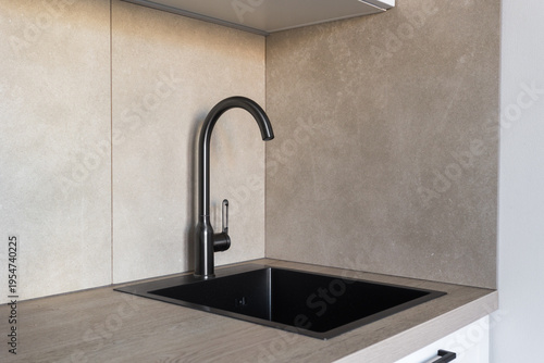 kitchen faucet on a stylish metal sink