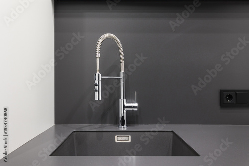 kitchen faucet on a stylish metal sink