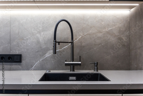 kitchen faucet on a stylish metal sink
