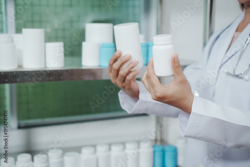 Pharmacist or lab technician in white coat holding blank pill bottles in a pharmacy storage room, checking medicine containers on shelves, healthcare and pharmaceutical inventory concept.