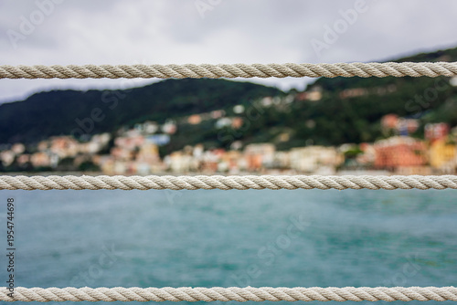 Obraz na plátne taut ropes mark the boundary of the Laigueglia seaside walkway