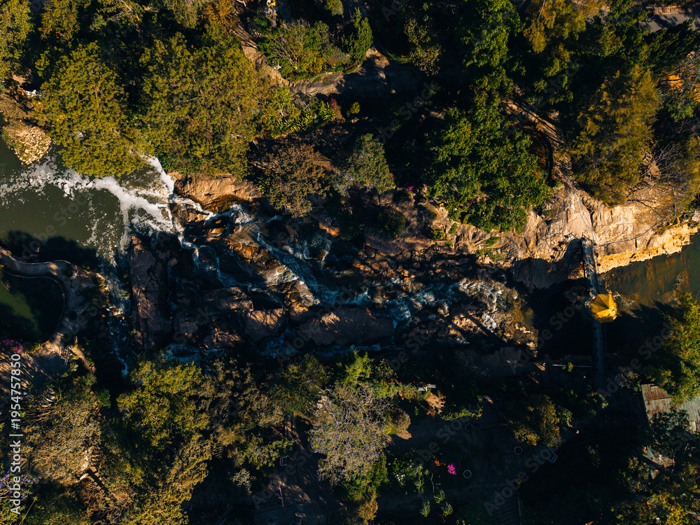 Obraz premium River rapids flowing through rocky forested canyon from above Da Lat Vietnam
