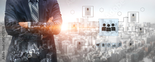 Fotografie Professional businessman stands confidently in front of urban skyline, showcasing a digital network for team communication and collaboration strategies for business success