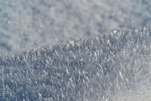 Принти на полотні Detailed view of sparkling ice crystals forming a textured frozen surface in win