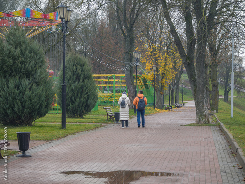 Wallpaper Mural Woman and a man walk down a brick path in a park Torontodigital.ca