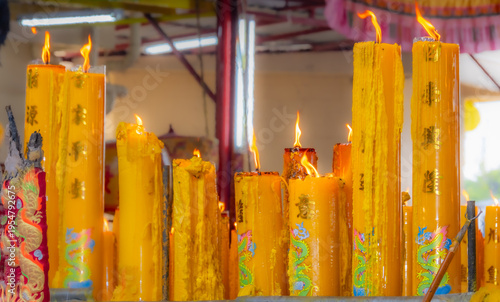 Wallpaper Mural A brightly colored candle in a Chinese Buddhist temple in Bangkok, Thailand. Torontodigital.ca