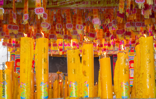 Wallpaper Mural A brightly colored candle in a Chinese Buddhist temple in Bangkok, Thailand. Torontodigital.ca