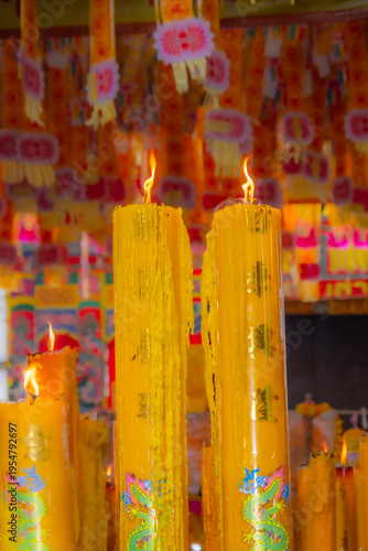 Wallpaper Mural A brightly colored candle in a Chinese Buddhist temple in Bangkok, Thailand. Torontodigital.ca