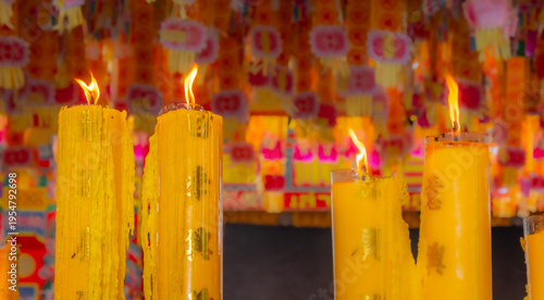 Wallpaper Mural A brightly colored candle in a Chinese Buddhist temple in Bangkok, Thailand. Torontodigital.ca