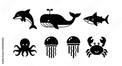 Set of cute ocean animal icons: dolphin, whale, shark, octopus, jellyfish, crab