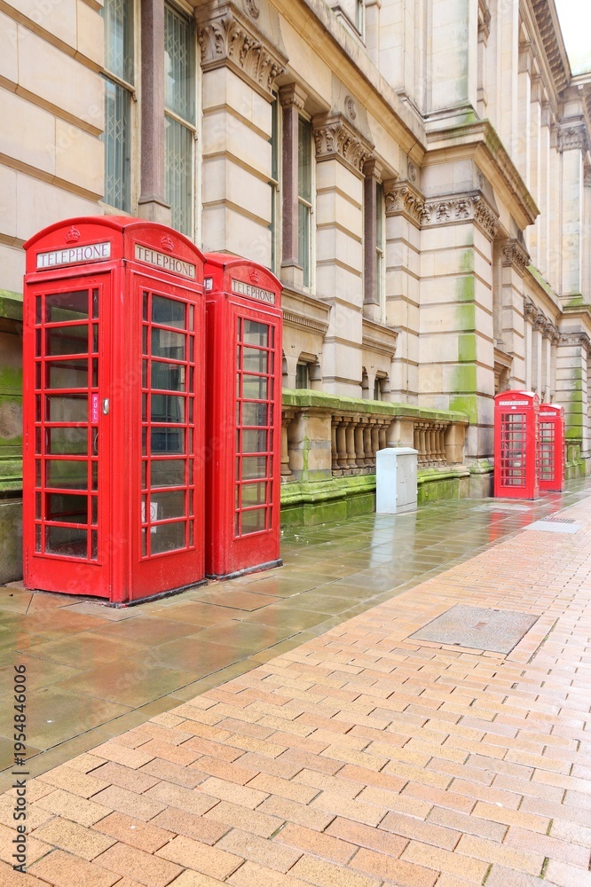 Fototapeta premium British symbol - red telephone booths street view in Birmingham, UK.