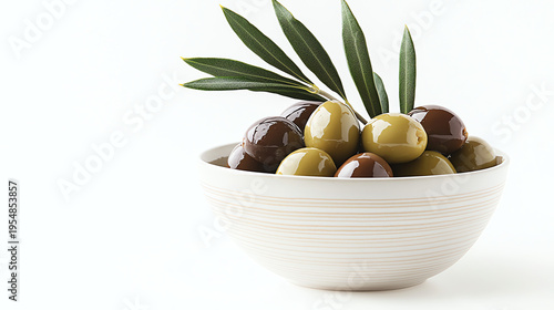 Glossy Green and Brown Olives in Ceramic Bowl with Olive Leaves