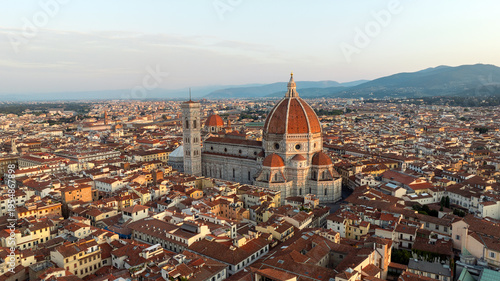 Drone shot Florence Italy summer sunrise city landscape. Santa Maria del Fiore cathedral dome aerial view. Scenic historic landmark Tuscany travel photography renaissance beauty background.