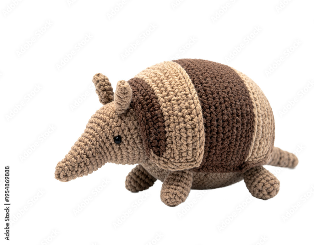 Obraz premium Handmade Crochet Armadillo Plush Toy Isolated on Black Background, Cute Knitted Animal Stuffed Toy for Kids and Home Decor