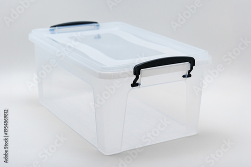 Clear storage box with lid and handles for organizing items easily