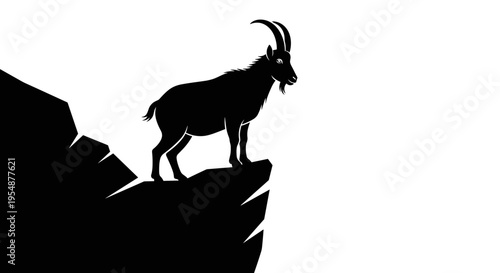 Goat standing on mountain peak.