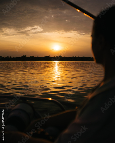 woman on boat at sunset on zambezi river