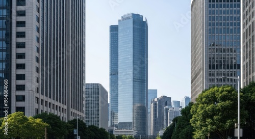Tall glass and concrete buildings line a city street under a bright sky