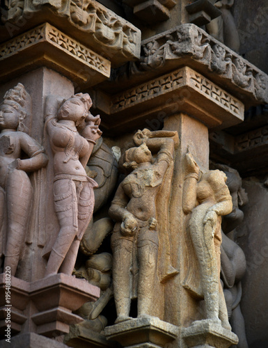 Stone carving bas relief sculptures on Khajuraho Temple, India.