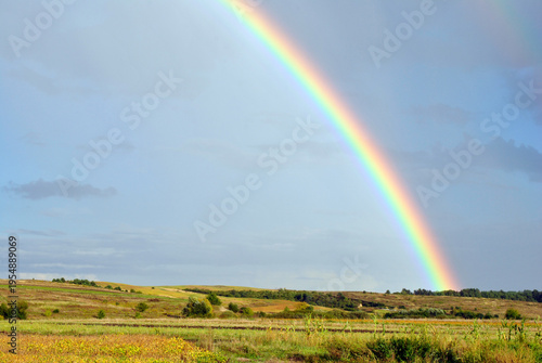 rainbow over green field