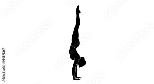 Silhouette of a Woman Performing a Handstand Yoga Pose