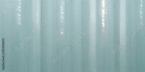 Abstract a serene background featuring a mesmerizing turquoise backdrop, elegantly accentuated by soft, vertical light beams, and hinting at energy and modernity.