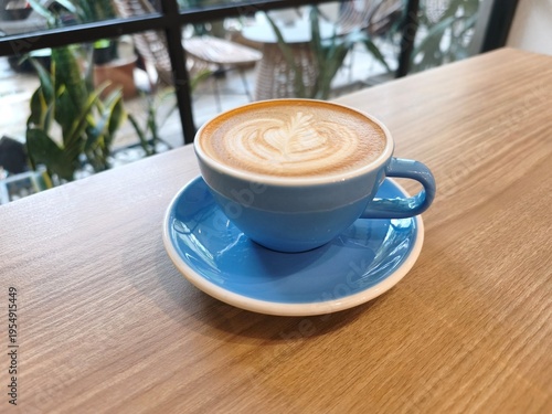 Caffeine moment in blue ceramic cup