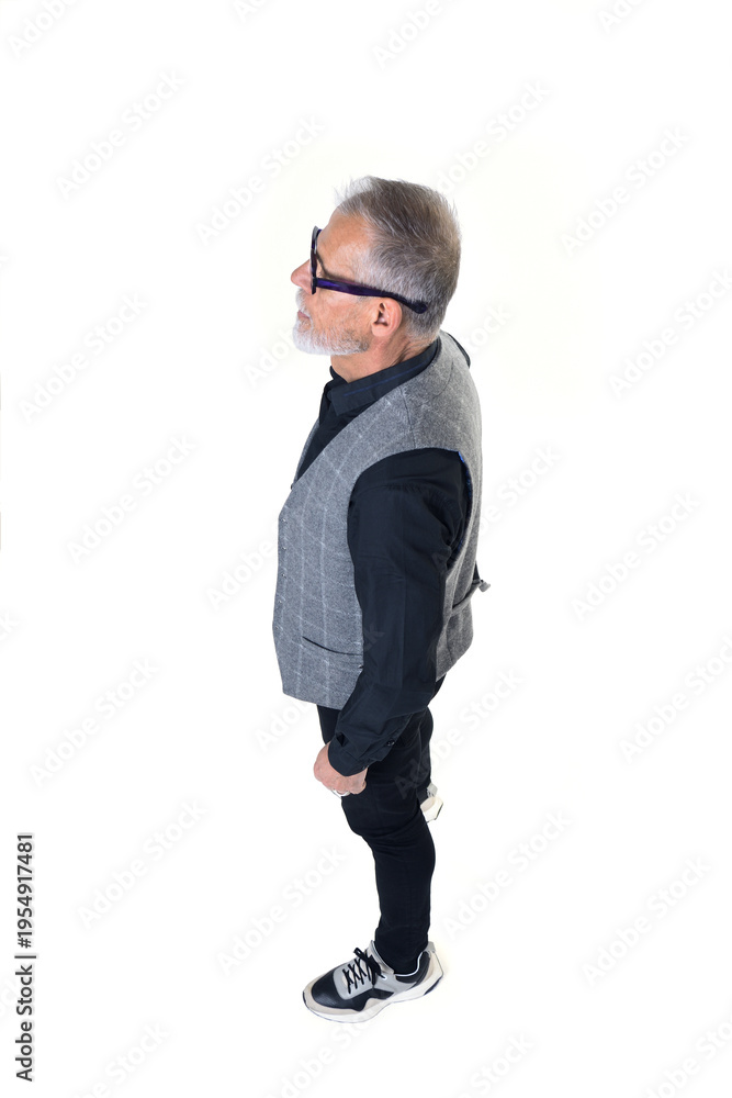 Fototapeta premium Side view of a portrait of a mature man seen from above on a white background.