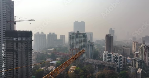 Aerial view of a building under construction in the middle of Mumbai city, India. The image captures urban development and high-rise construction activity.