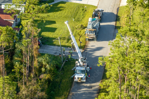 Photos Electrical service company restoring power repairing damaged power lines after h